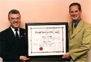 Pat Flood receiving his Certificate Of Embalming in 1997 from the Chairman Of the Irish Division